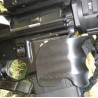 Polymer grip to the magazine well Black